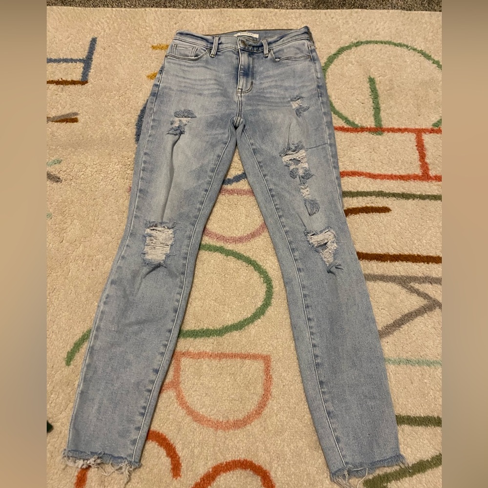 Medium wash distressed PacSun jeans. High rise jegging. Size 24.